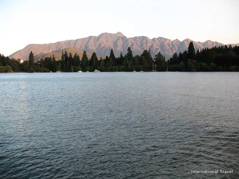 Sunset Across The Lake Against The Mountains